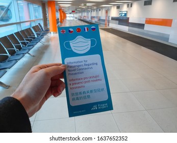 2020/02/06, Prague, Czech Republic: Hand Holding A Pamphlet About Coronavirus Prevention And Safety Regulation, Freely Issued On Vaclav Havel Airport