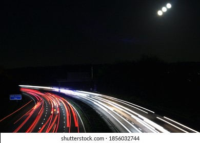 2020's Autumn Blue Moon Shining On Motorway Traffic Flow On Super Highway In  England, UK