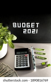 2021 Budget Concept With Letters On Black Background And Blurred Calculator, Pins, Dollars