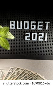 2021 Budget Concept For New Fiscal Year With Letters On Black Background And Blurred US Dollar Currency 