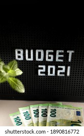 2021 Budget Concept For New Fiscal Year With Letters On Black Background And Blurred Euro Currency 