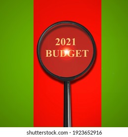 2021 Budget Concept Through Magnifier On Old Paper With Red Vertical Line Background.