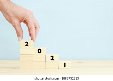 2021 concept. cubes on wooden table - Shutterstock ID 1896732613