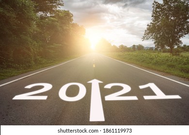 2021 concept. the growth up road sign in 2021 new year with road bacground, the direction way of 2021 to success - Shutterstock ID 1861119973