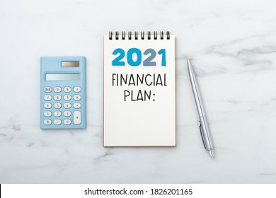 2021 Financial Planning Text On Notebook With Calculator And Pen