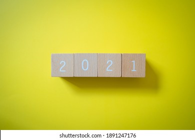 2021; Four wooden blocks with 2021 text of concept.