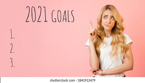 2021 Goals List. Blonde Woman Thinking Setting Goal Checklist And Making Wishes For Upcoming New Year Standing Over Pink Background. Waiting And Planning 2021 Year Concept. Panorama, Mockup