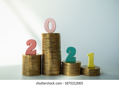 2021 Money, Business And Planning Concept. Colorful Wooden Number Letter Stack Of Gold Coins.