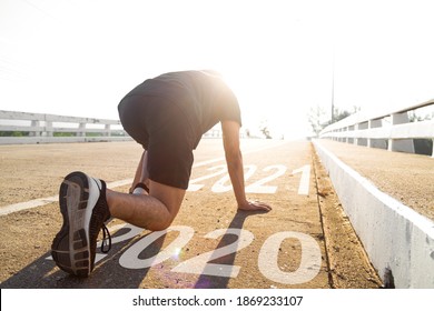 2021 New Year 2020 Is Passed ,Asian Man In Sport Running Cloth In Start Posture 	
