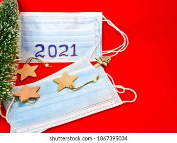 2021 New Year. Medical Virus Protection Mask. Inscription 2021. Holiday Red Background. Top View.  Flat Lay. Felt Texture