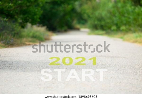 2021 New Year start text on the road trip travel\
and future vision concept.