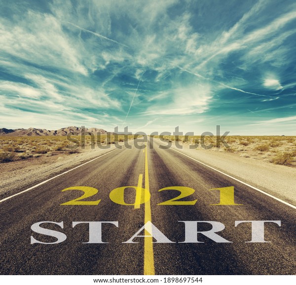 2021 New Year start text on the road trip travel\
and future vision concept.