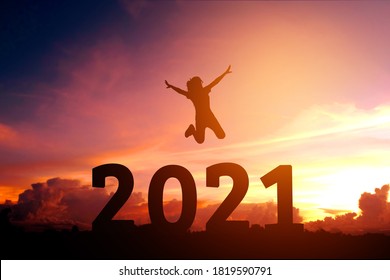 2021 Newyear Silhouette Young Woman Jumping To Happy New Year Concept.