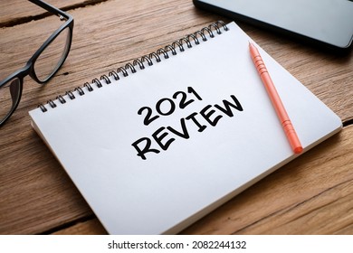 2021 Review, last year review in life, flat lay business concept. Writing and preparing for new year 2022 resolutions