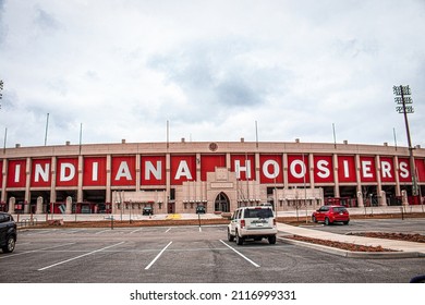 2021-03-26-Bloomington Indiana USA - Side view of Hoosier Indiana Football stadium and ticket offices with parking lot in foreground and a few parked cars - Copy space