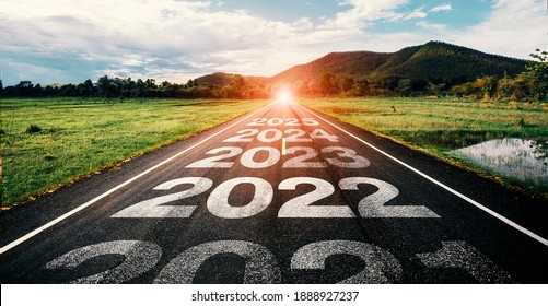 2021-2025 written on highway road in the middle of empty asphalt road and beautiful blue sky. Concept for vision 2021-2025.