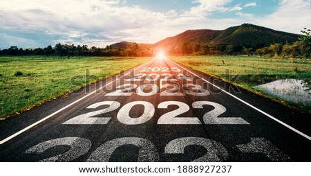 2021-2025 written on highway road in the middle of empty asphalt road and beautiful blue sky. Concept for vision 2021-2025.