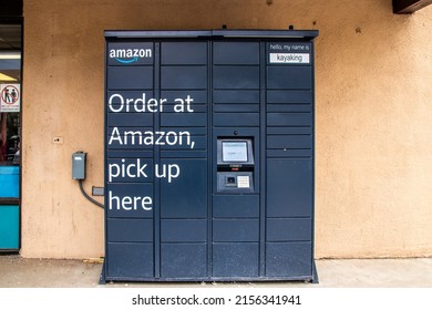 2021_05_21_Taos New Mexico USA Amazon Pick Up Locker Outside Stucco Convivence Store In American Southwest