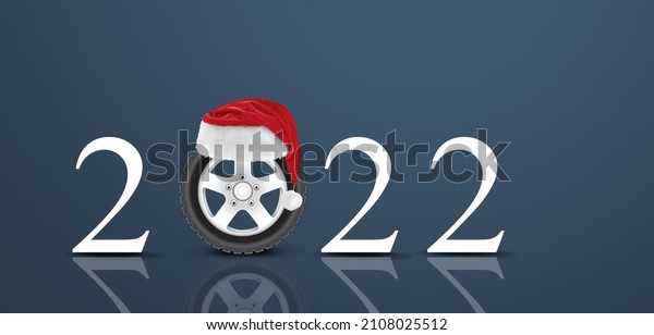 2022 Auto wheel in Santa\'s hat. New Year for auto\
workshop, auto shop.