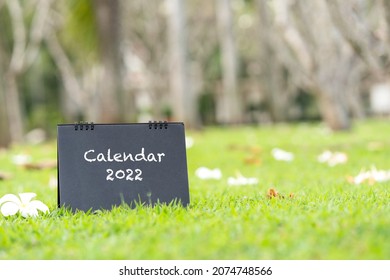 2022 Black Card Calendar On Grass, The Purpose For Business Planner, Reservation, Event Schedule, Planning, Appointment, Timetable, Timeline, Payment, Activity Reminder, Personal Holiday Booking