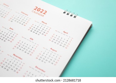 2022 calendar page on blue background business planning appointment meeting concept - Shutterstock ID 2128681718