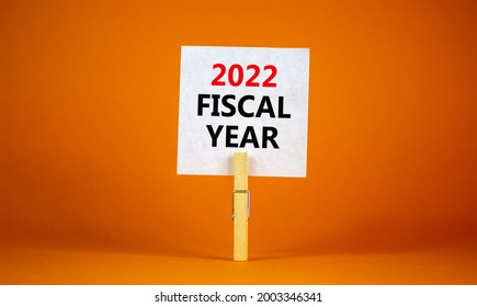 2022 Fiscal New Year Symbol. White Paper With Words '2022 Fiscal Year', Clip On Wooden Clothespin. Beautiful Orange Background. Business And 2022 Fiscal New Year Concept. Copy Space.