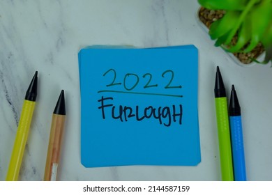 2022 Furlough Write On Sticky Notes Isolated On Wooden Table.