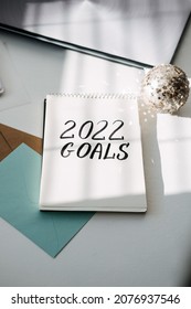 2022 Goals, New Year Resolution. Text 2022 Goals In Open Notepad On The Table. Start New Year, Planning And Setting Goals For The Next Year