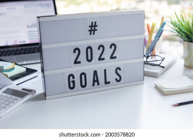 2022 goals text on light box on desk table in office.Business motivation or management.
