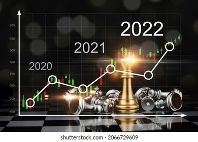 2022. golden king chess with silver chess piece on chess board game competition with graphic graph chart diagram on dark background, investment financial, stock market, business strategy concept