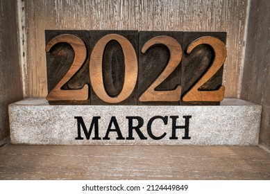 2022 March typography in vintage letterpress wood type inside grunge wooden box, low angle macro shot, calendar concept