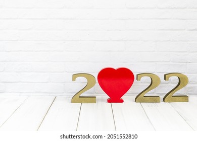 2022 new year and heart  on white wood table over white background with copy space , love concept