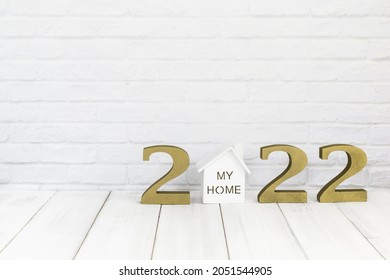 2022 new year and home  on white wood table over white background with copy space , Real estate concept