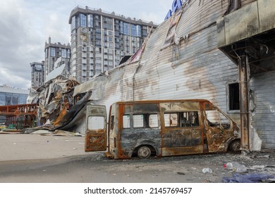 2022 Russian invasion of Ukraine Bucha war torn city destroyed car burn out. Aftermath shell of civilian bombed city Bucha damage building destruction. Bomb attack Russia war damage Ukraine war crime