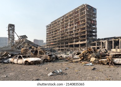2022 Russian invasion of Ukraine war torn city destroyed car burn out. Russia war damage building destruction city war ruins city damage car. Terror attack bomb shell of civilian bombed. Disaster area