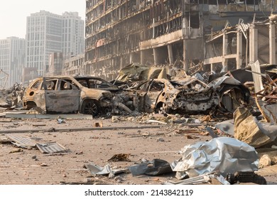 2022 Russian Invasion Of Ukraine War Torn City Destroyed Car Burn Out. Russia War Damage Cars Destruction City Ruins Building Insurance Car. Consequences Attack. Bombed Building Explosion Debris