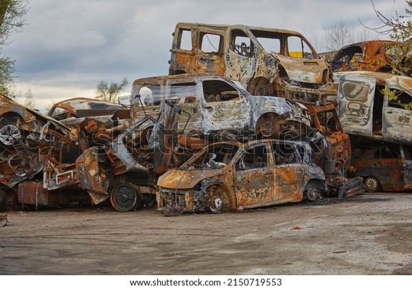 2022\
Russian invasion of Ukraine war destroyed car burn out. Russia war\
damage building destruction city war ruins city damage car. Terror\
attack bomb shell of civilian bombed. Disaster\
area.