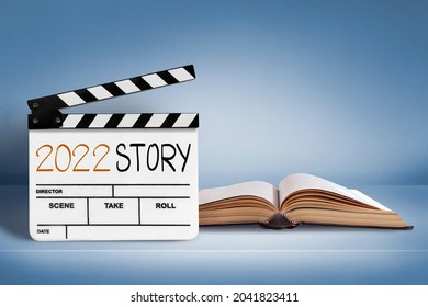 2022 Story.Text Title On Film Slate And Old Book.happy New Year Concept.