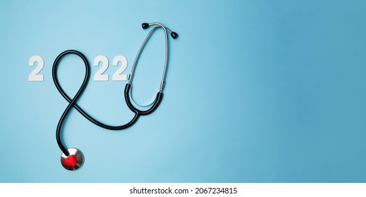 2022 Wooden Number With Stethoscope. Happy New Year For Heart Health And Medical Concept, Life Insurance Business, New Year Resolutions Goal. High Quality Photo