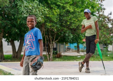 2022.08.11. Dominican Republic. Veron. Two Boys Are Playing Baseball Outside Their House.