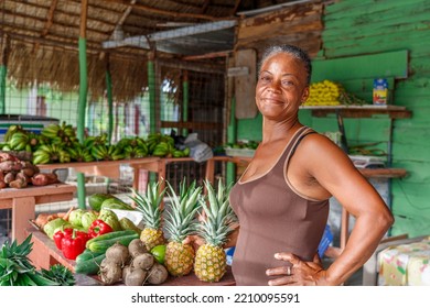 2022.09.17. Dominican Republic. Veron. An Elderly Woman Poses In Her Fruit Stand.