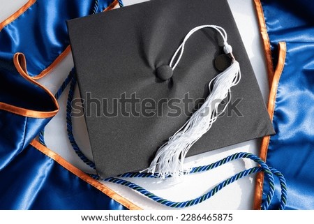 2023 Celebration Orange and Blue Cap and Gown Mortarboard Graduation Ceremony Regalia with Stole, White Tassel and Cord