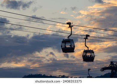 2023 Dec 30,Hong Kong.Ngong Ping 360 cable car on Tung Chung ,Lantau Island, Hong Kong. Cable car just leave the Tung Chung City. - Powered by Shutterstock