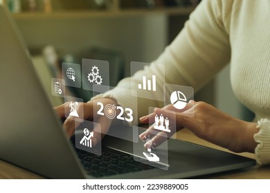 2023 Goal plan action, Businesswoman making her plans and goals for the new year 2023 on the laptop. Business annual plan and development for achieving goals. Goal achievement and success in 2023. - Powered by Shutterstock