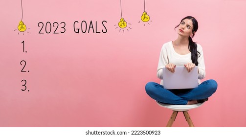2023 goals with young woman using a laptop computer - Shutterstock ID 2223500923