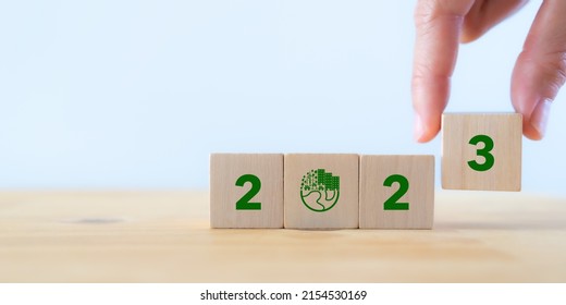 2023; Green Business, Enviromental Sustainability. Carbon Offset And Neutrality Strategies.  2023 Written On Wooden Cubes And Green Community. Goals,plan,opportunity, New Green Business And Social.