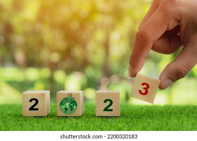 2023; Green Business, Enviromental Sustainability Target. Carbon Offset, Neutrality Strategies. 2023 Written On Wooden Cubes With Green Background. Green Community. New Green Business And Social.