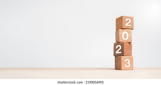 2023 Happy New year background banner. Two thousand Twenty-Three year numbers on wooden cube blocks stack on white background with copy space. Welcome, Merry Christmas, and Happy New Year in 2023. - Shutterstock ID 2190056905