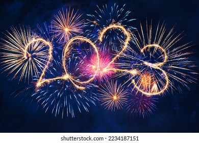 2023 happy new year concept with sparkles in the night sky. Sparkle firework on black background for banner