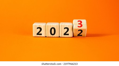2023 happy new year symbol. Wooden cubes symbolize the change from 2022 to the new year 2023. Beautiful orange table orange background. Copy space. Business and 2023 happy new year concept. - Shutterstock ID 2197966213